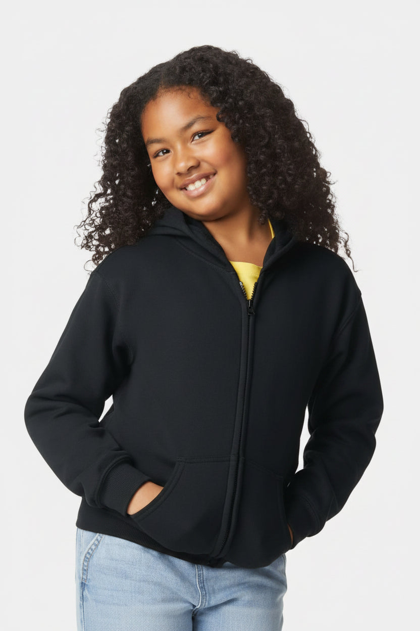 Child wearing a black jacket with a plain background