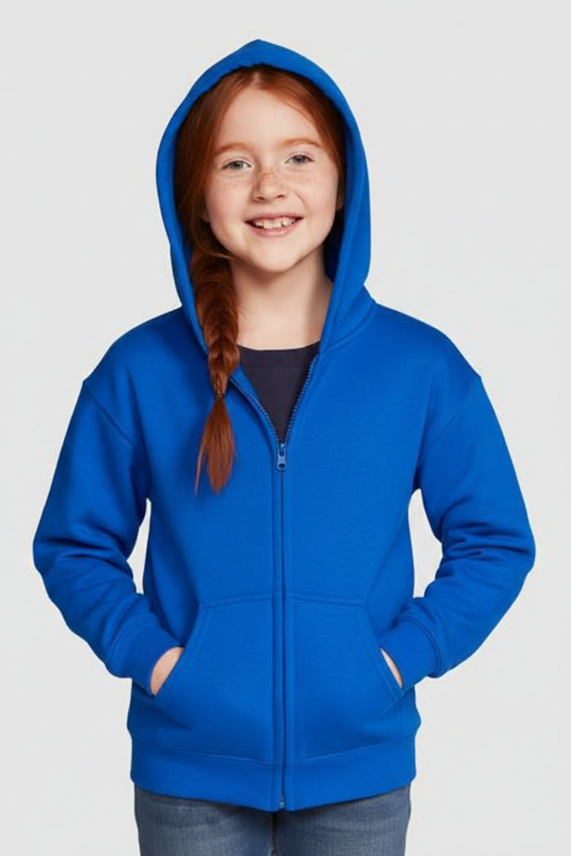 Young girl wearing a blue hoodie against a light gray background